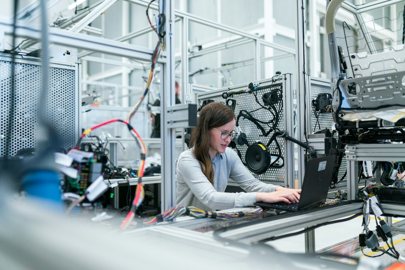 Engineer working at an automated battery-technology test bench